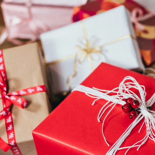 3 presents wraped in Red, white and kraft coloured paper