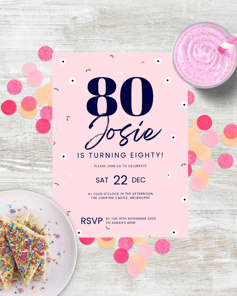 Festive invitation for an 80th birthday, featuring colorful confetti and a pink dessert on a rustic wooden table.