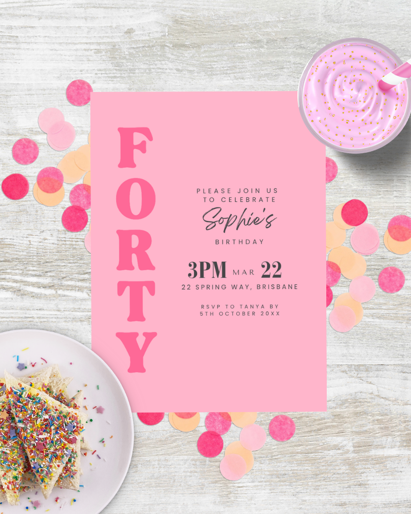 Festive pink invitation with bold letters, sprinkles on dessert, and colorful confetti on a wooden surface.
