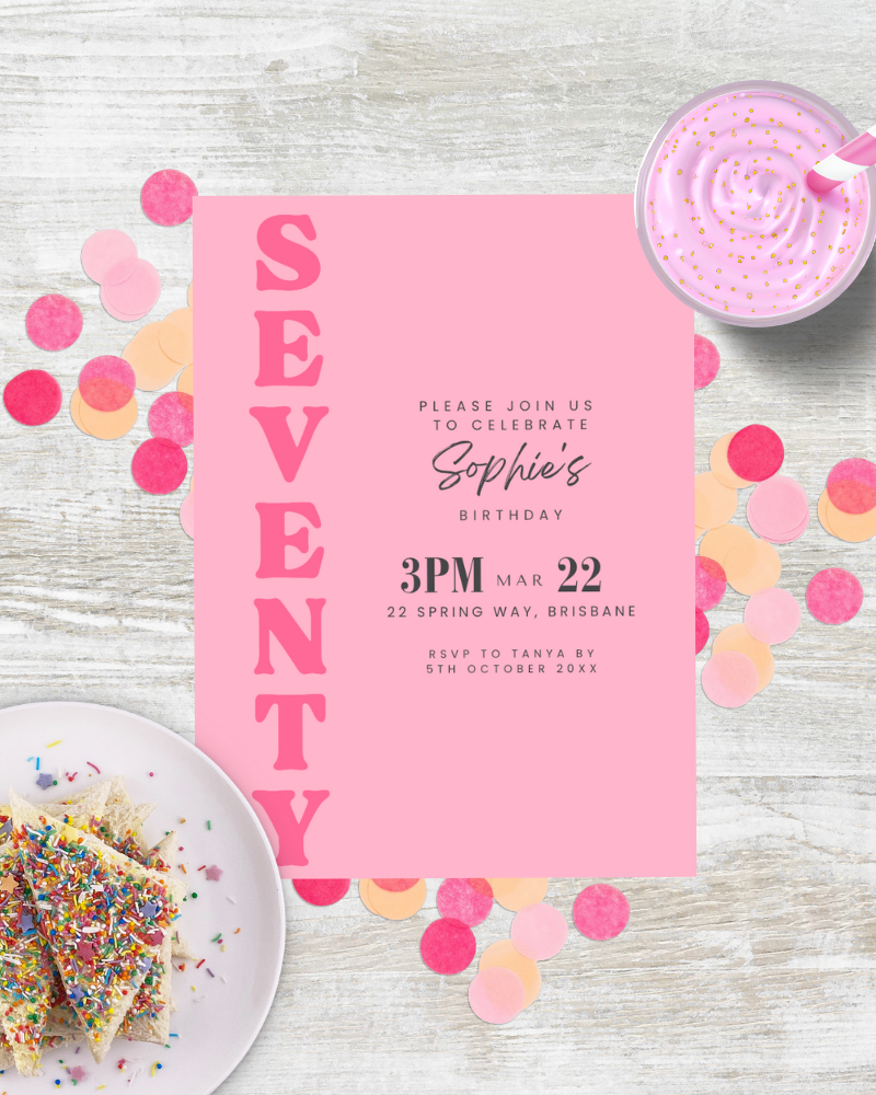 Invitation for Sophie's 70th birthday with colorful confetti and birthday cake slices on a wooden surface.