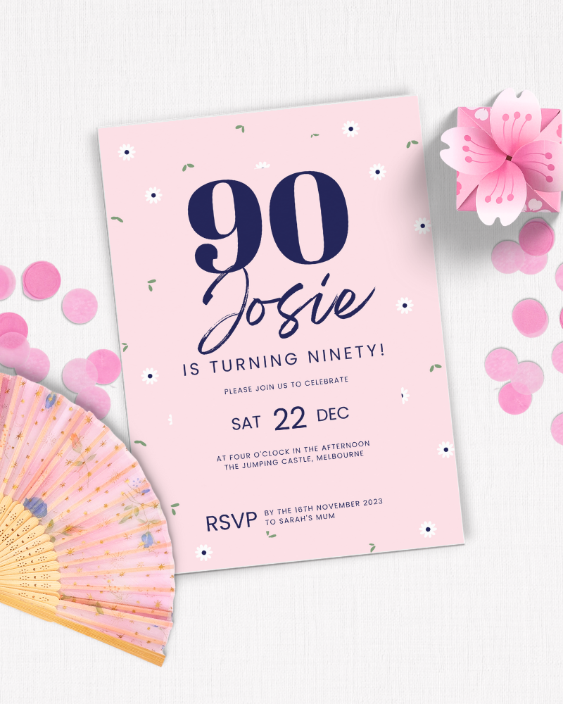 Ninety birthday invitation with floral accents, pink background, and decorative elements, including a fan and confetti.