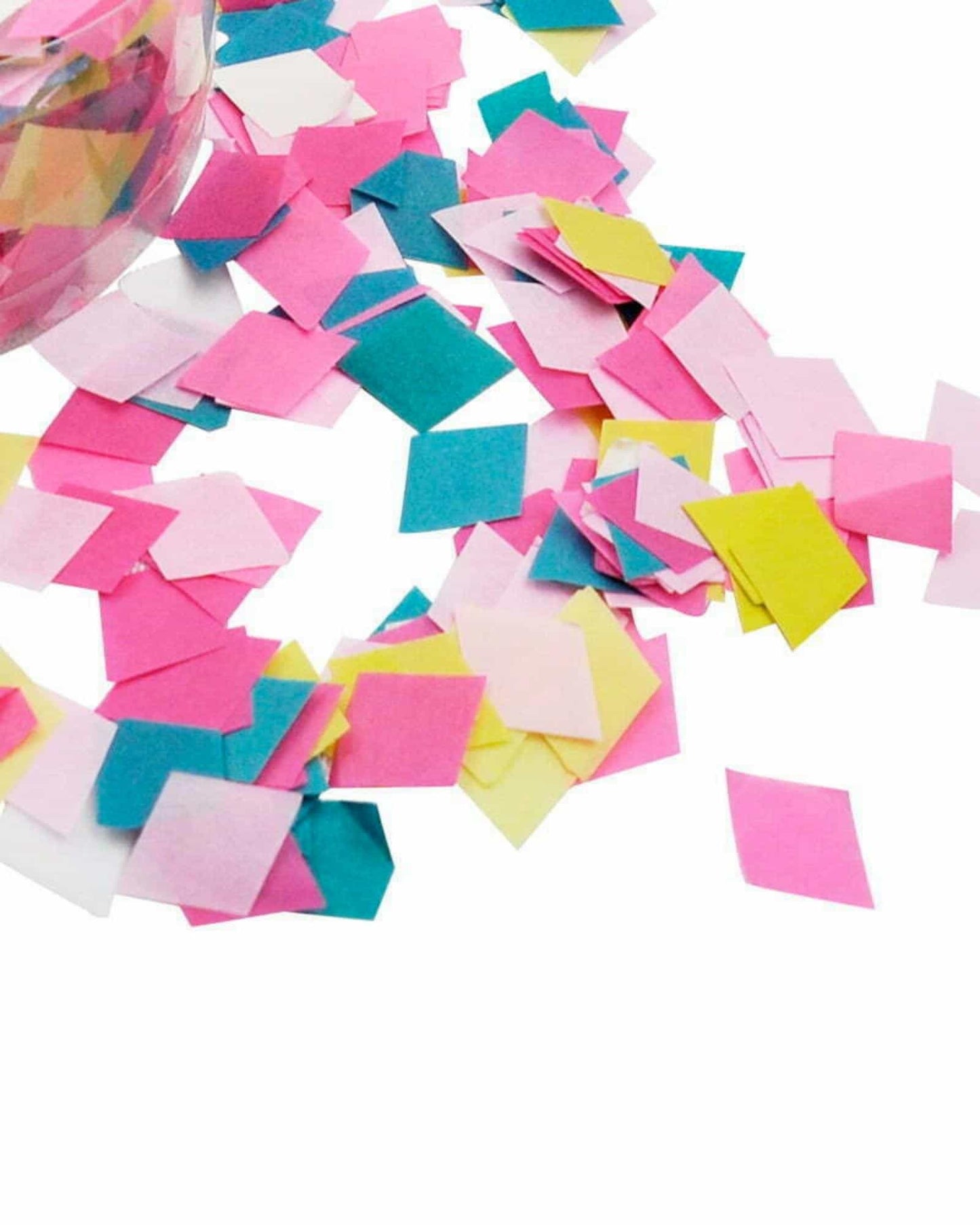 Colorful square paper pieces in pink, yellow, blue, and white scattered around a transparent container.