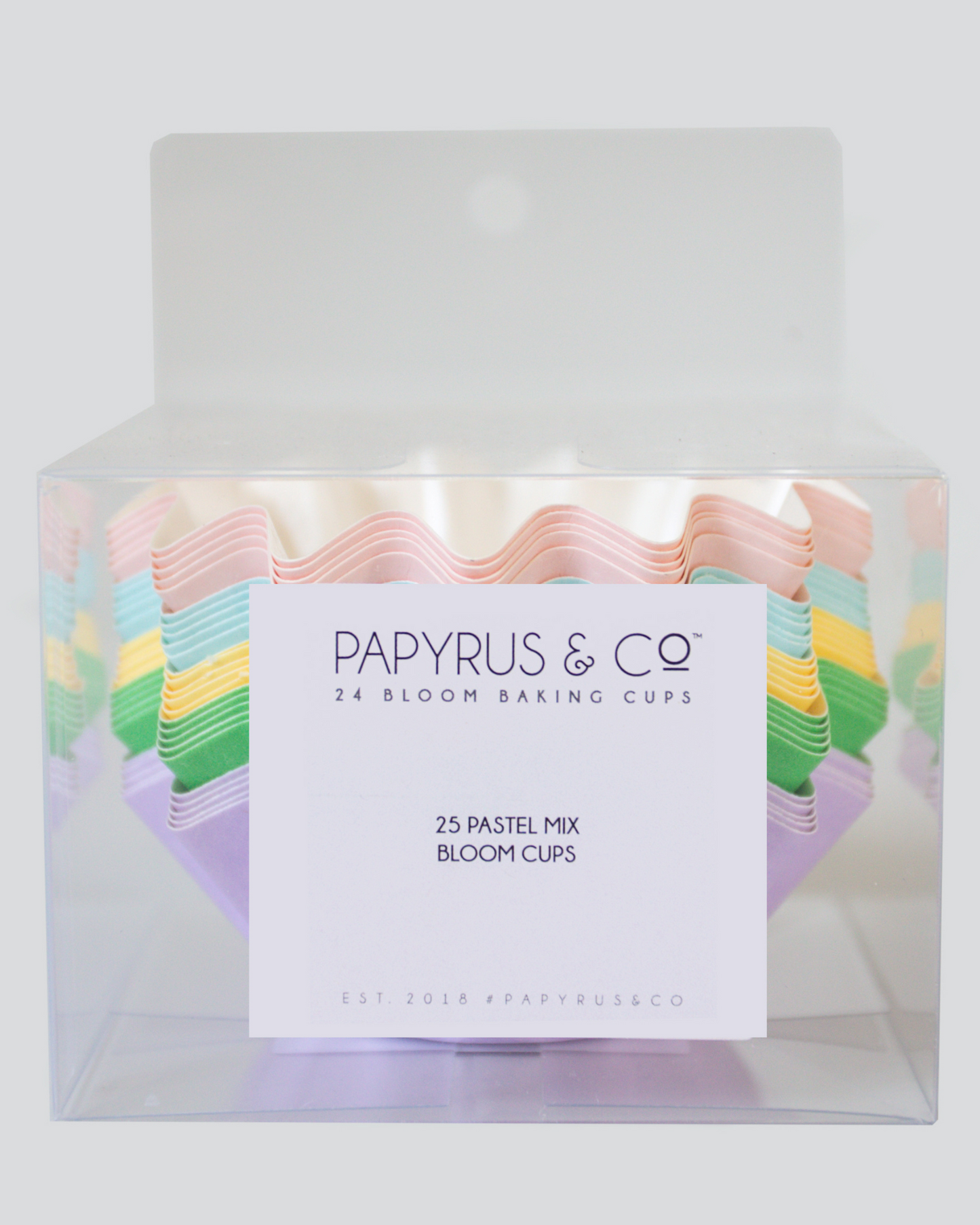 Colorful pastel cups arranged in a clear box, featuring wavy edges and a label for a baking supply brand.