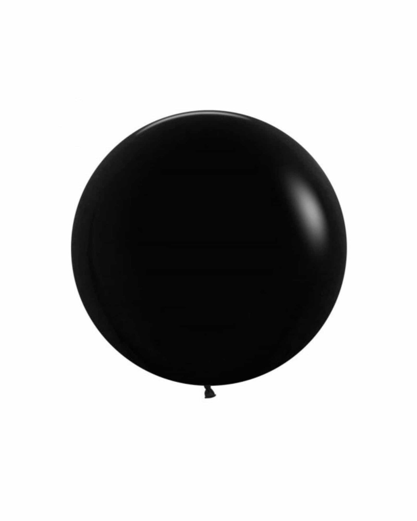 A glossy black balloon, round and smooth, stands out against a neutral background.