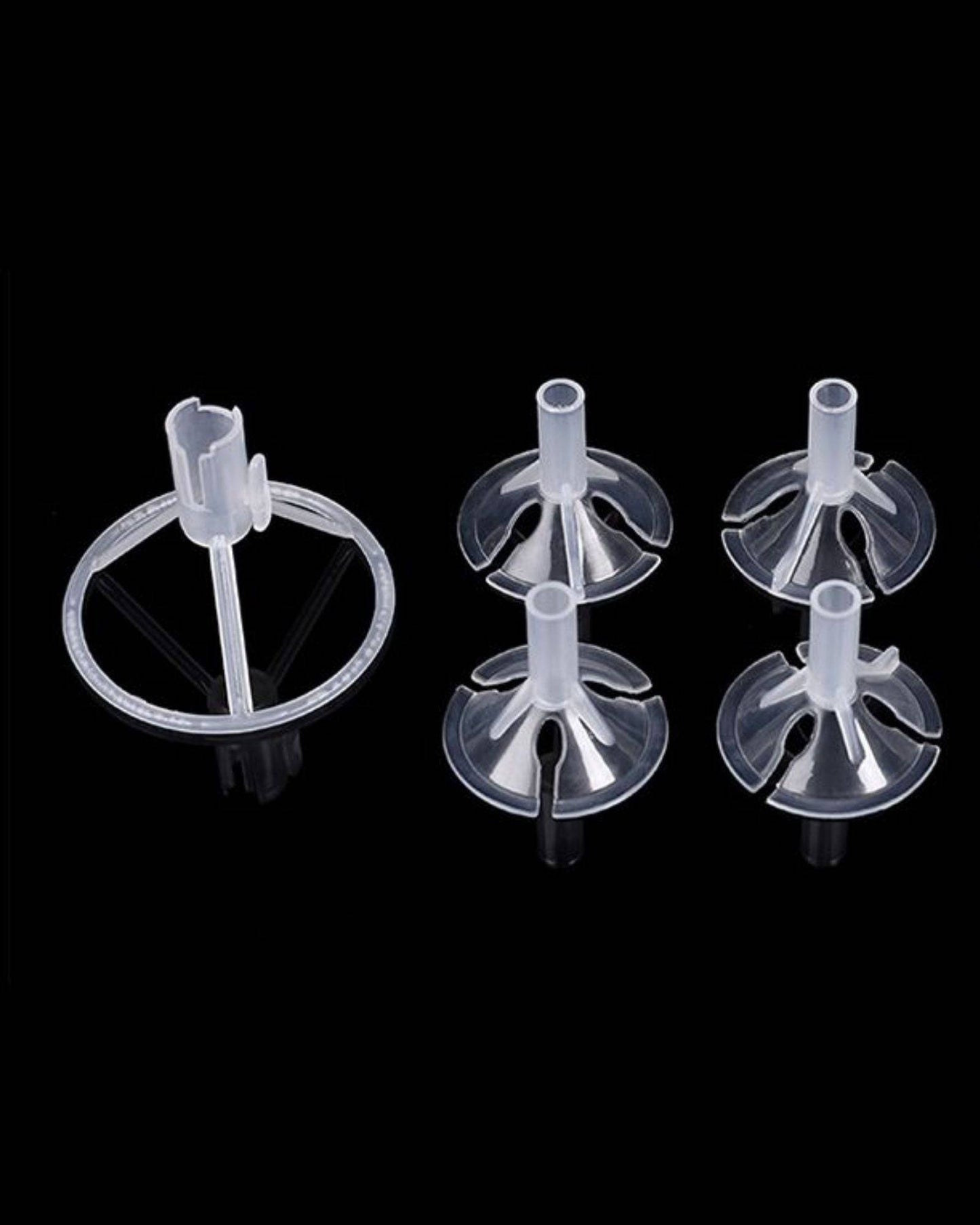 Clear plastic holders with circular bases, designed for supporting balloons, arranged against a black background.