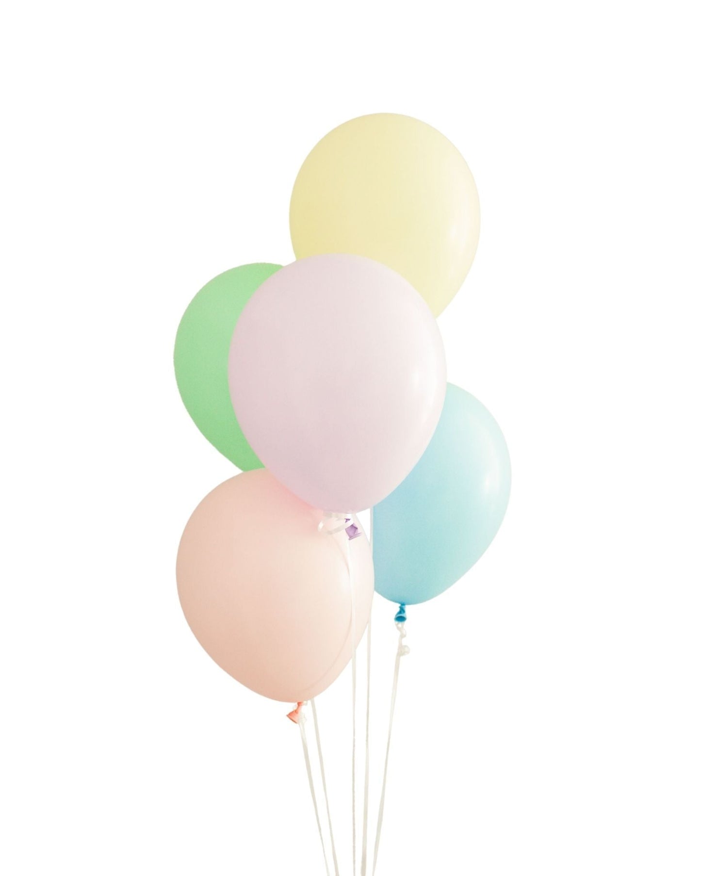 A cluster of pastel balloons in pink, green, yellow, and blue, tied together with white strings against a white background.