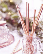 Metallic Rose Gold Foil Paper Straws Present in Glass- A Little Whimsy