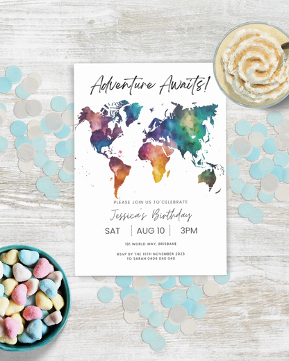 A colorful world map invitation for a birthday celebration, surrounded by pastel confetti and a dessert.