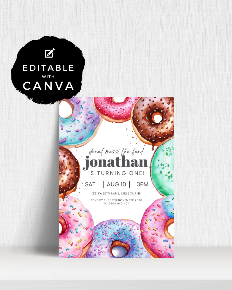 Colorful donuts with sprinkles surround a birthday invitation for Jonathan’s first birthday celebration.