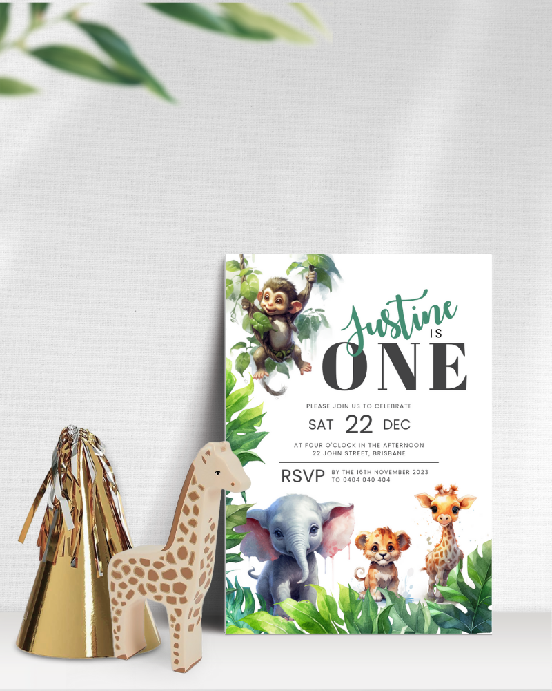 Colorful invitation featuring a monkey, elephant, lion cub, and giraffe surrounded by lush greenery and playful elements.