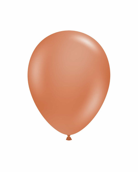 Single, rounded balloon in a warm, earthy tone against a plain white background.