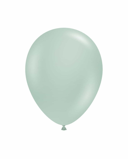 A single pale green balloon floating against a white background, reflecting soft light for a gentle appearance.