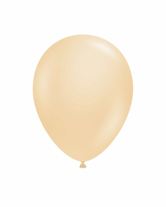 A single, glossy beige balloon floats against a plain white background, capturing a light and festive mood.