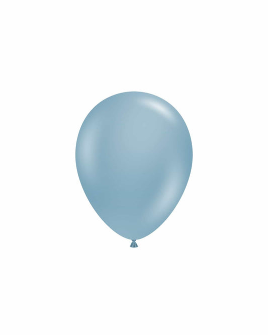 A glossy, light blue balloon floats against a plain white background, showcasing its smooth surface and rounded shape.