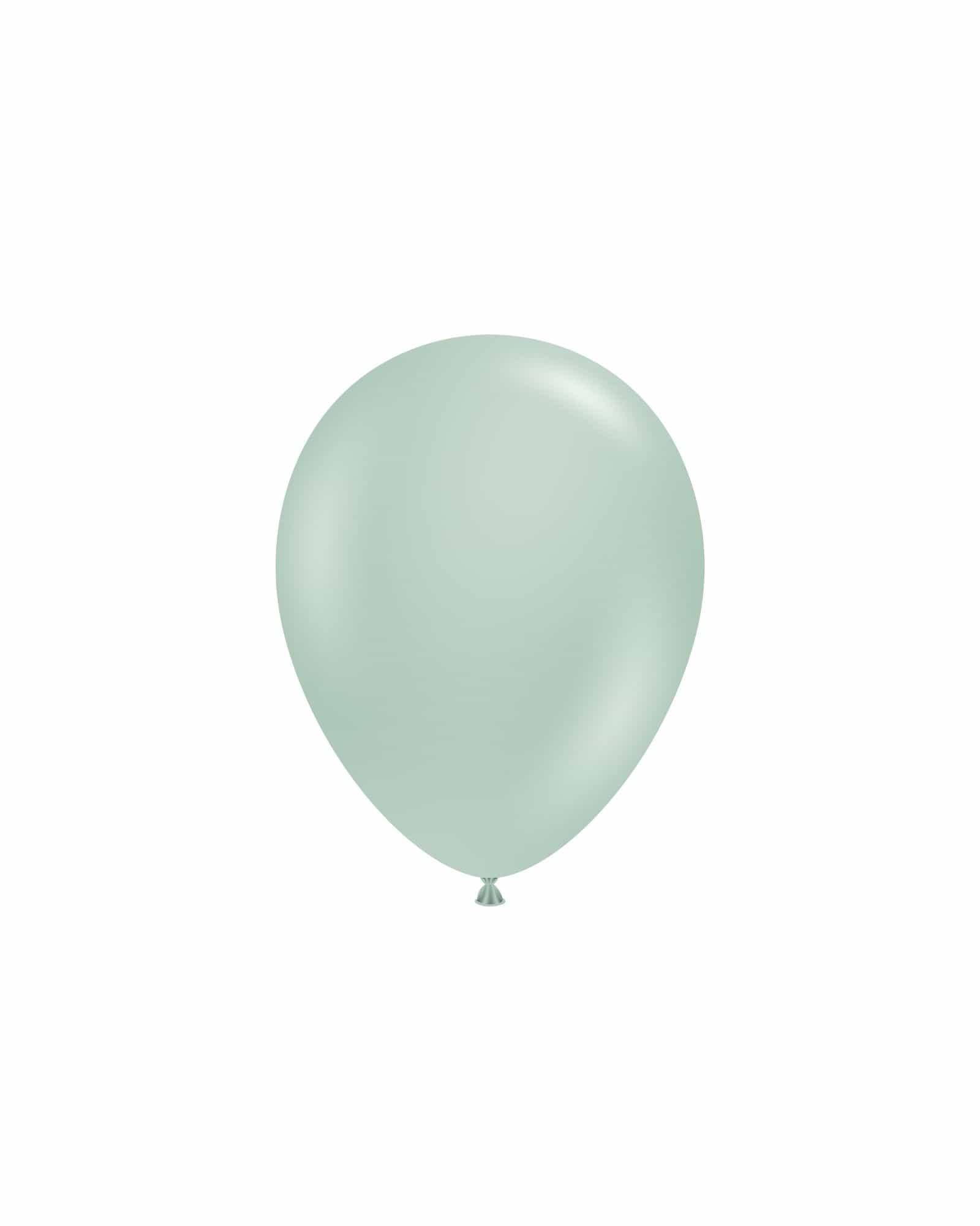 A smooth, mint green balloon floats against a white background, showcasing its glossy finish and rounded shape.