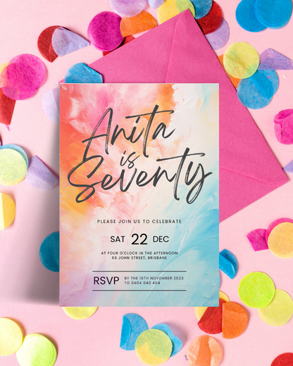 Colorful invitation with artistic swirls, surrounded by colorful confetti and a pink envelope on a pastel background.