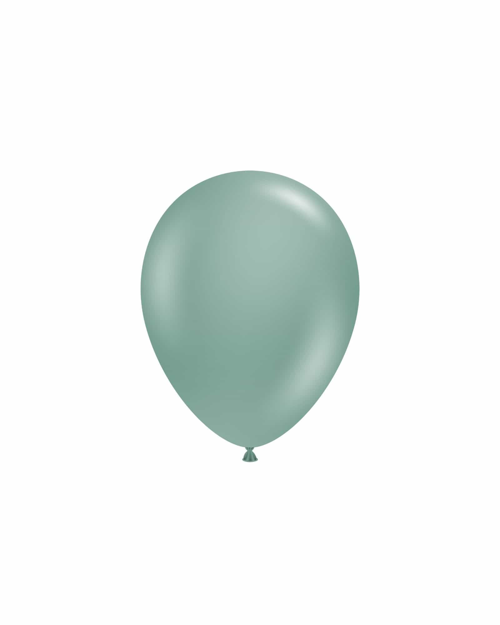 A single, matte teal balloon floats against a white background, featuring a smooth, rounded shape and subtle sheen.