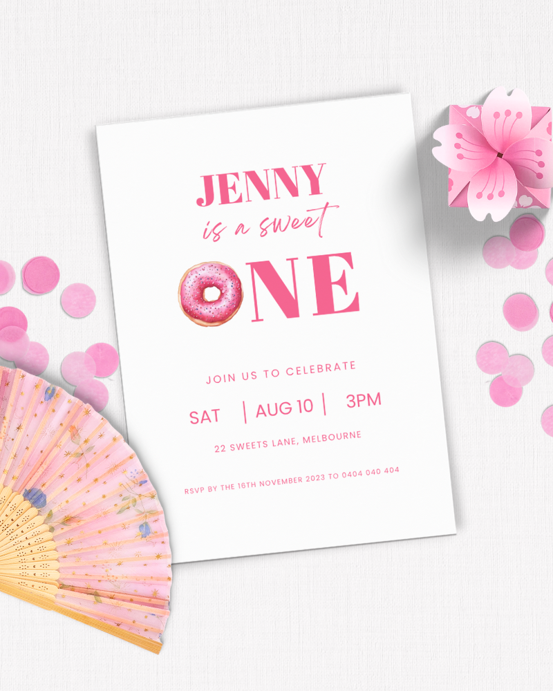 Invitation featuring pink text, a donut illustration, confetti, and a decorative fan for a birthday celebration.