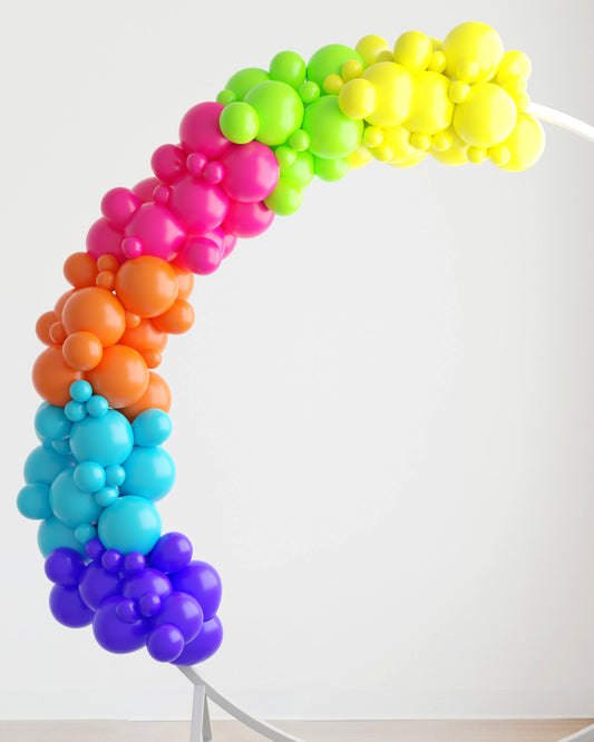 Colorful balloon garland in a rainbow gradient, arching gracefully against a light backdrop.