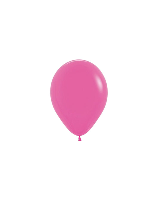 A vibrant fuchsia balloon with a glossy finish, gently tapering to a small knot at the bottom against a white background.