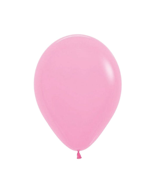 A glossy, round pink balloon with a tied end, floating against a plain background.