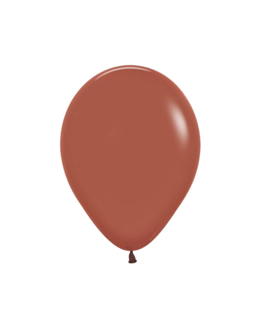 A glossy, terracotta balloon with a rounded shape and a tied end, set against a plain background.