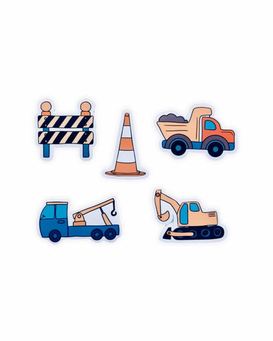 Four colorful construction-themed illustrations: a traffic cone, a barrier, a dump truck, and a tow truck.