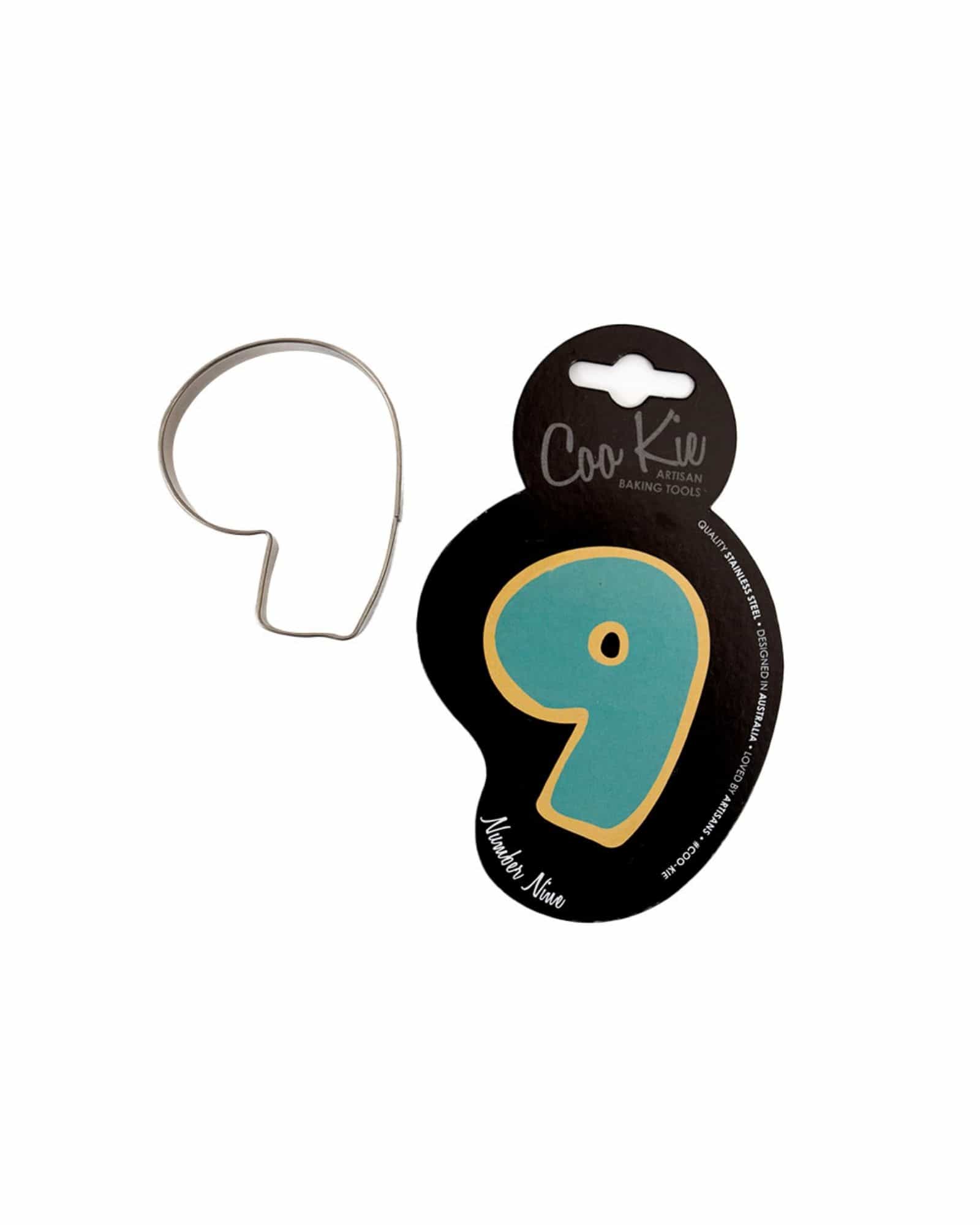 A metal cutter shaped like the number nine, accompanied by colorful packaging featuring a bold design.