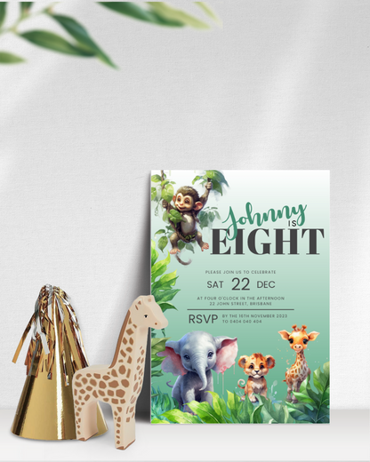 Colorful invitation featuring a playful monkey, elephant, and giraffe among lush greenery, with festive decor nearby.