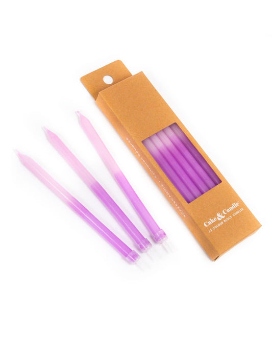 Vibrant purple candles with a gradient, neatly packaged in a brown box with a clear window. Perfect for celebrations.