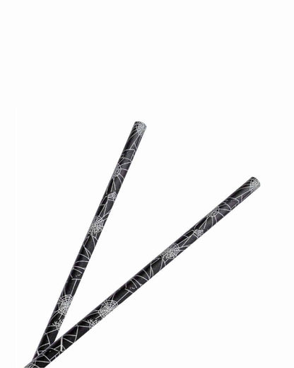 Two black sticks featuring intricate white spiderweb patterns against a clean, bright background.