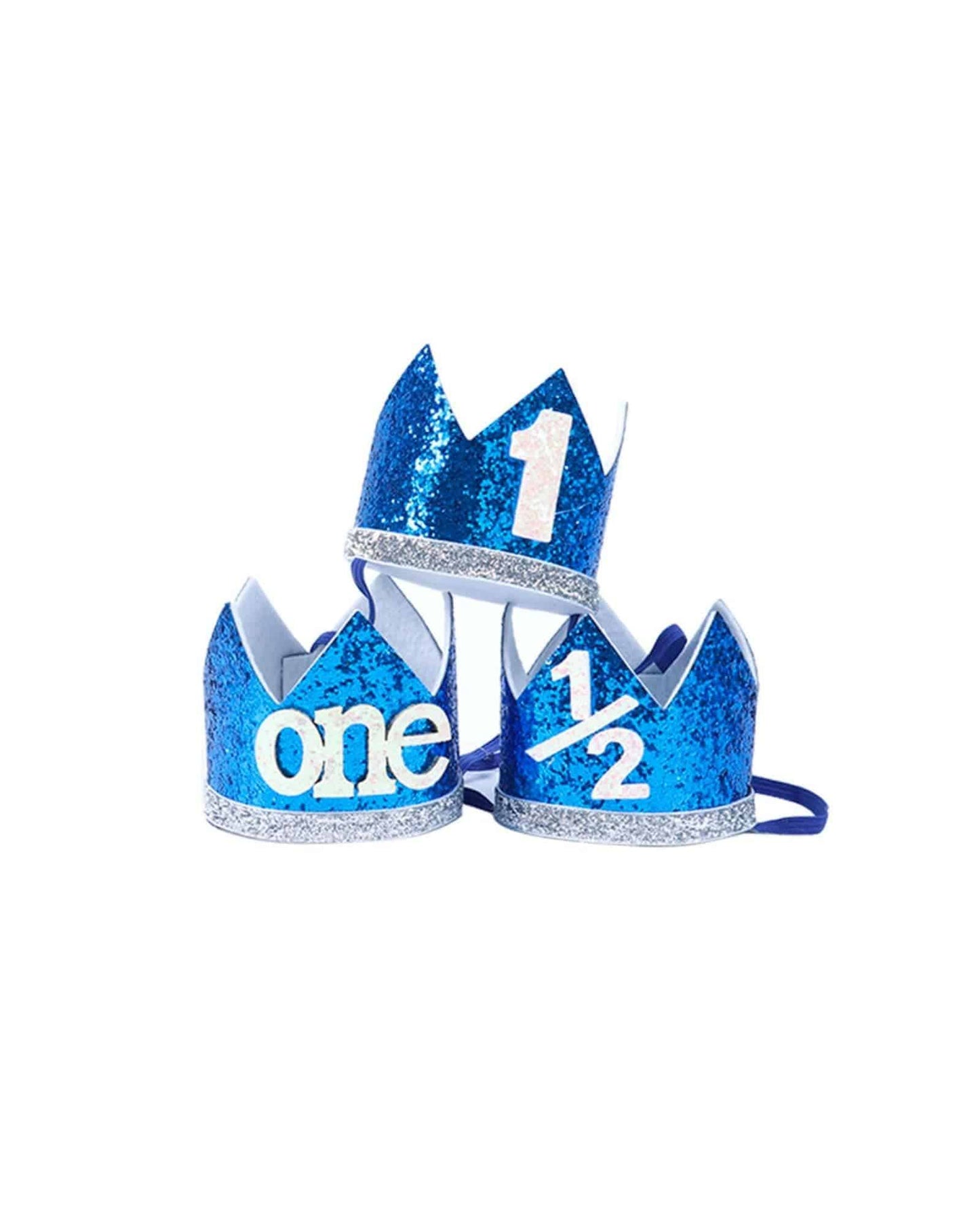 Three sparkling blue crowns with glitter, featuring the numbers "1," "one," and "1/2" in white.