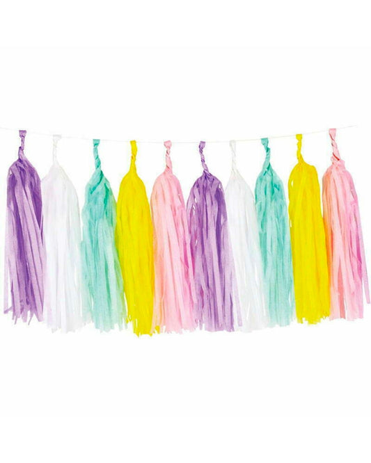 Colorful tassels in purple, pink, yellow, and green, hanging in a playful arrangement against a white background.