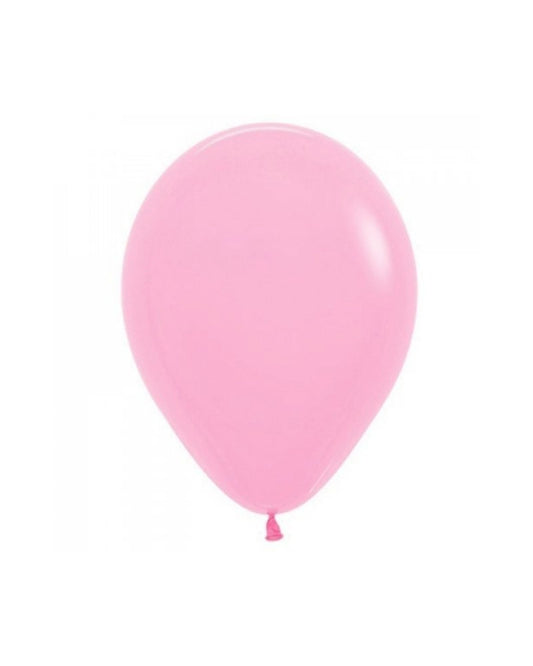 A smooth, round, pastel pink balloon floating against a plain white background.