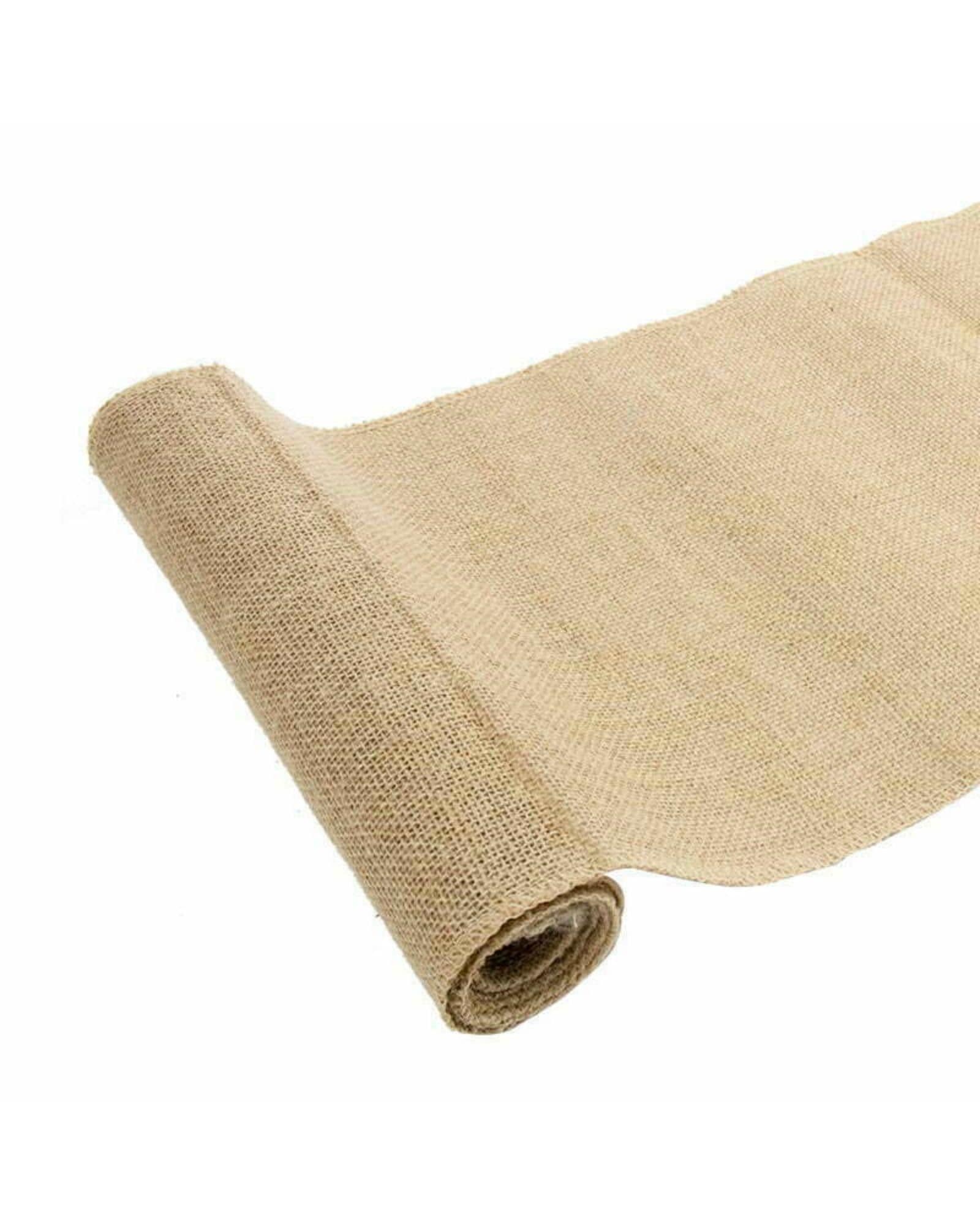 A rolled piece of natural, textured fabric in earthy tones, partially unrolled on a flat surface.