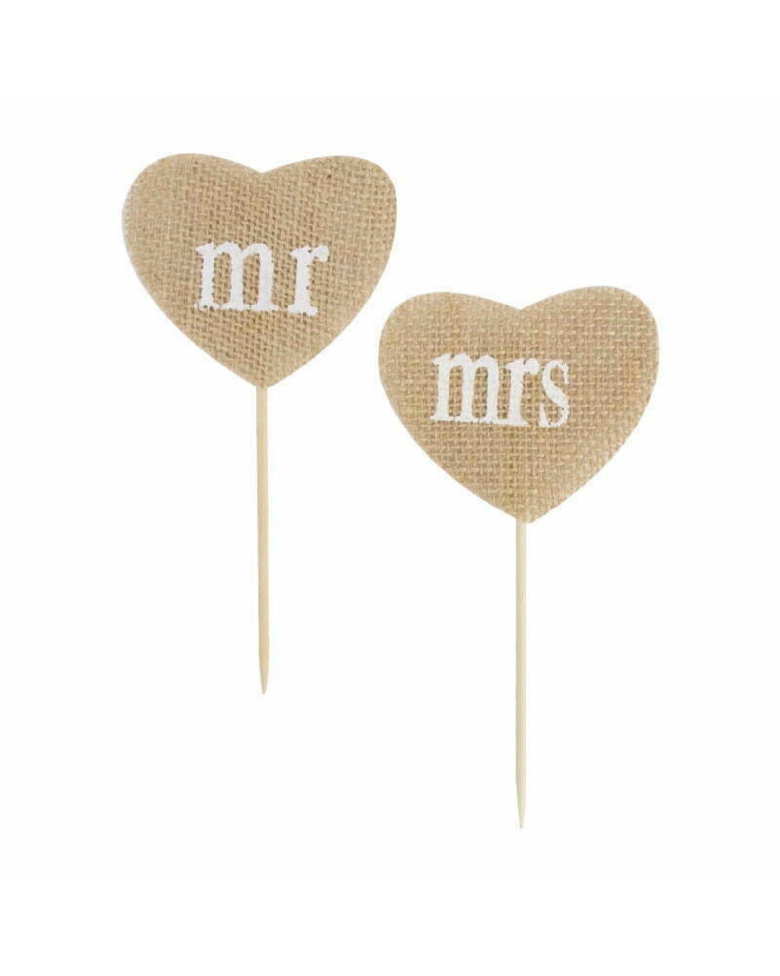 Two heart-shaped decorations in natural fabric featuring "mr" and "mrs" in white lettering on wooden sticks.