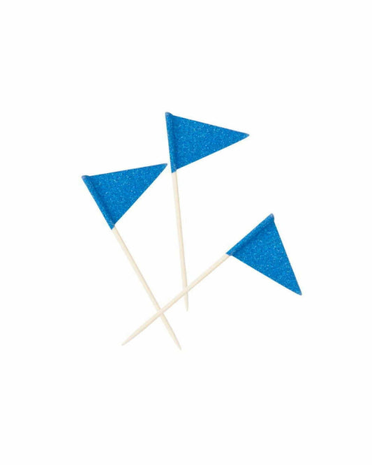 Three sparkling blue flags on wooden sticks, arranged playfully against a white background.