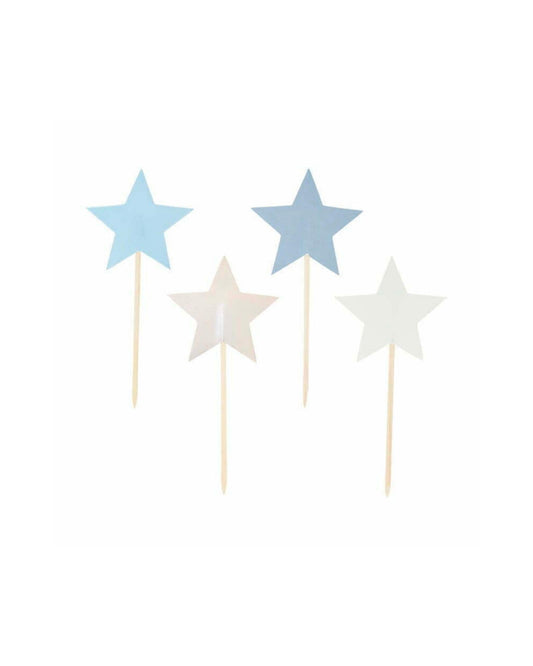 Four star-shaped toppers in shades of blue and white, each mounted on a wooden stick against a plain background.