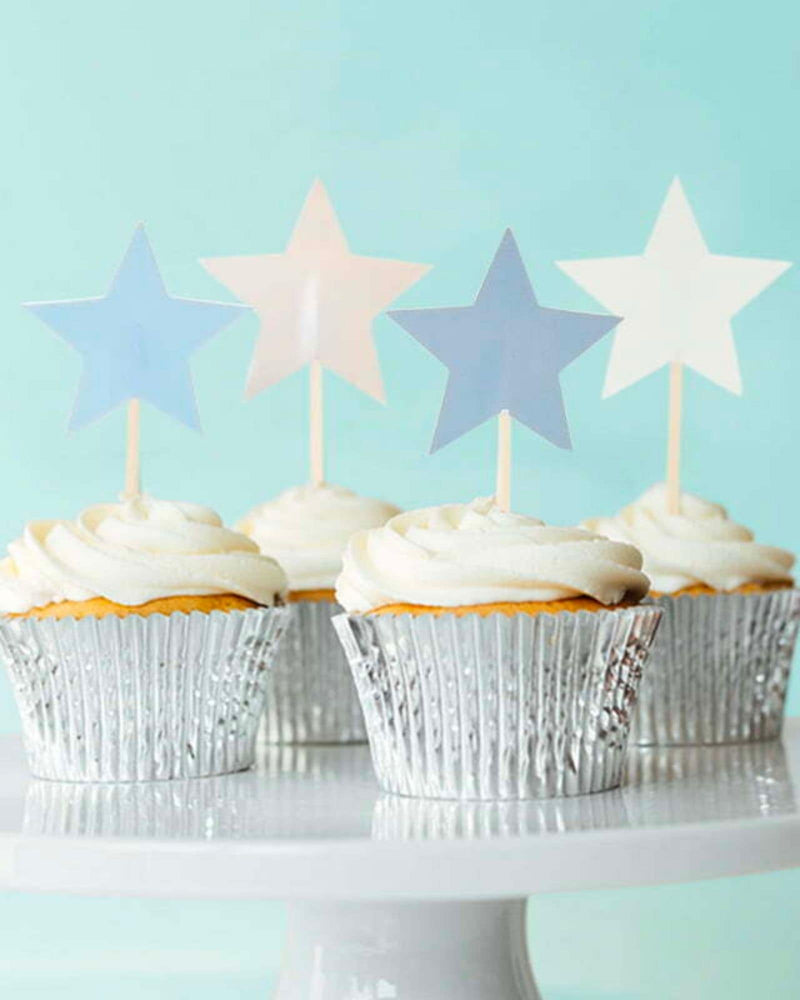 Star Shaped Cupcake Picks atop of cupcakes with white icing