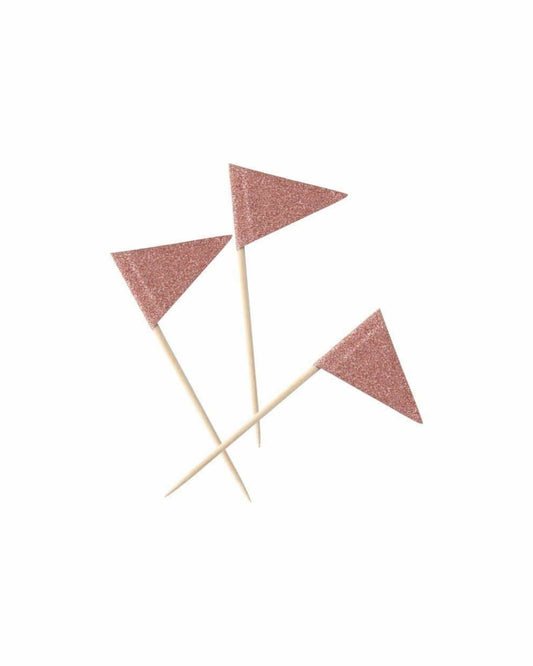 Three glittery, rose gold triangular toppers on wooden sticks, arranged on a clean white background.