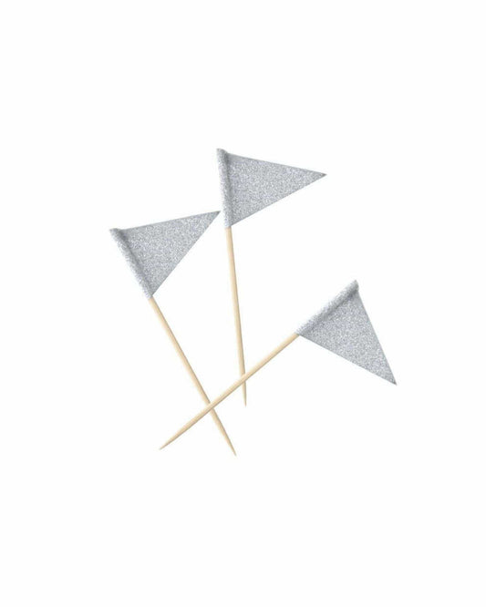 Three small silver glitter flags on wooden sticks, arranged against a plain white background.