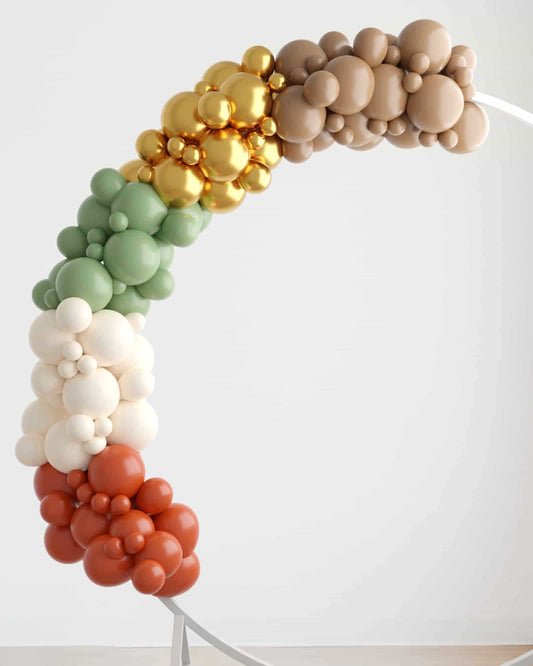 Colorful balloon garland in earthy tones, featuring shades of green, gold, beige, and terracotta, elegantly arched.