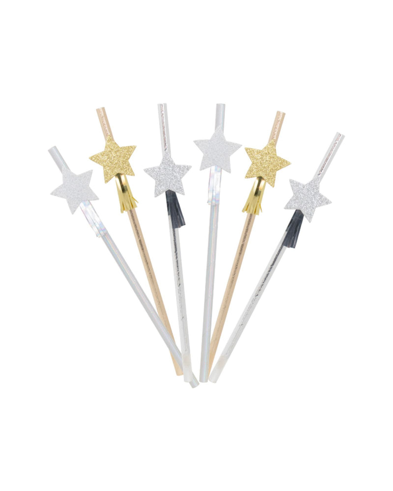Silver and gold paper straws with decorative stars on white background