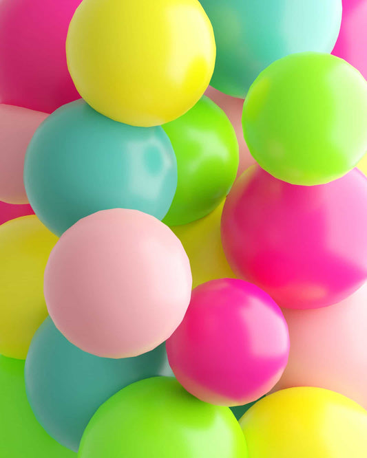 Colorful, glossy spheres in vibrant shades of pink, green, yellow, blue, and peach create a playful and cheerful arrangement.