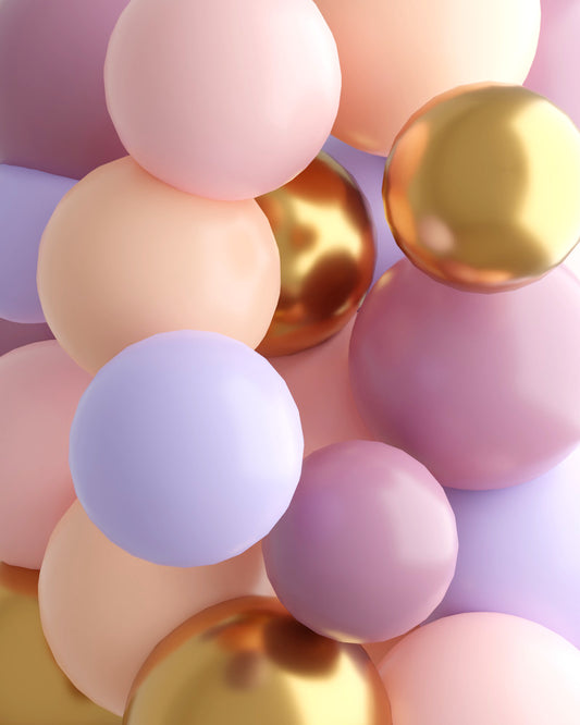 A colorful assortment of glossy spheres in pastel shades with metallic accents, creating a vibrant, festive look.