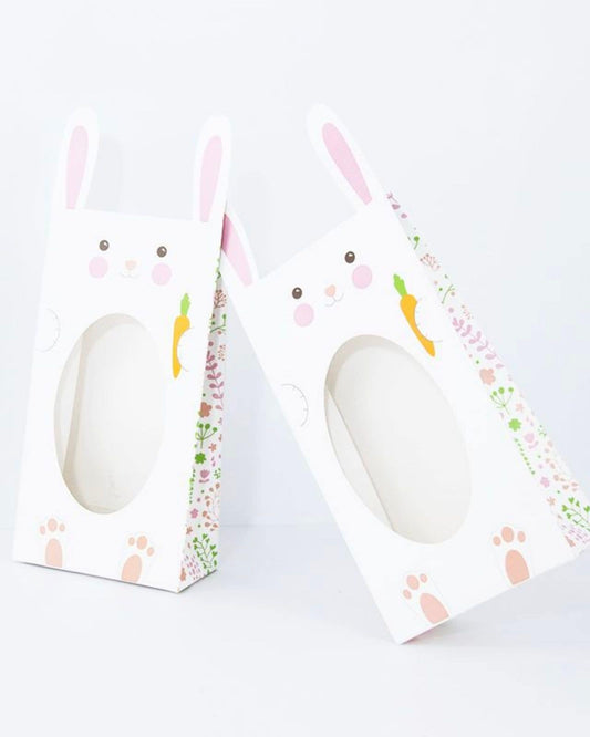 Two playful bunny-shaped bags with pink ears, floral patterns, and carrot illustrations, perfect for festive occasions.