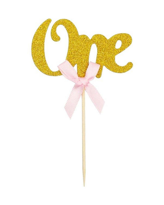 Glittery gold "One" topper with a pink bow, perfect for celebrations or special occasions.