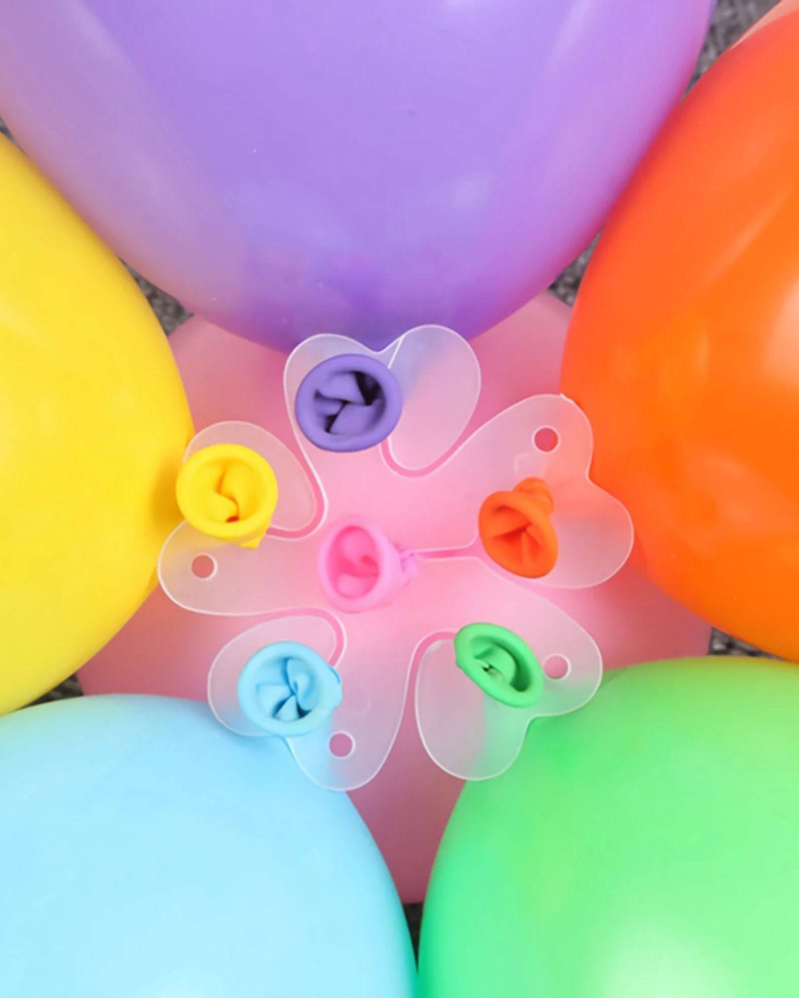 Colorful balloons in various shades surround a clear clip shaped like a flower, showcasing vibrant pastel hues.