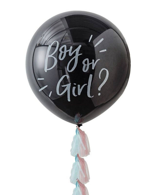 Black balloon with white text "Boy or Girl?" and pastel streamers in pink and blue hanging below.