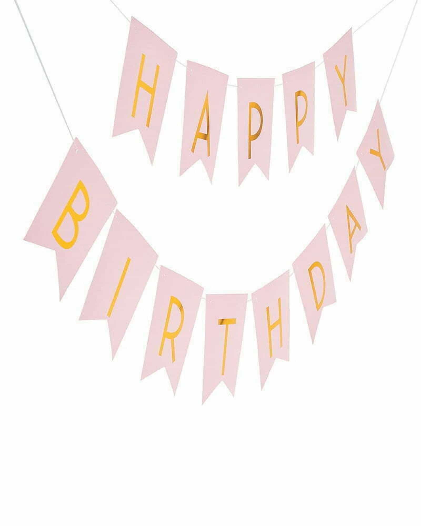 Light pink banner with gold lettering spelling "Happy Birthday" in a festive arrangement.